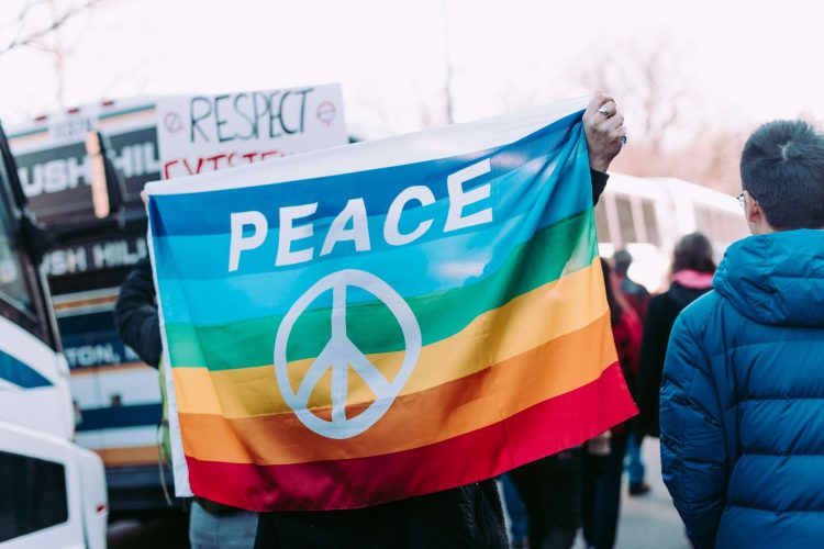 People Holding Peace Banner and Respect Sign